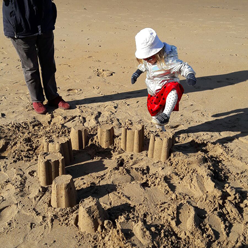 Matilda stamping on sand castles