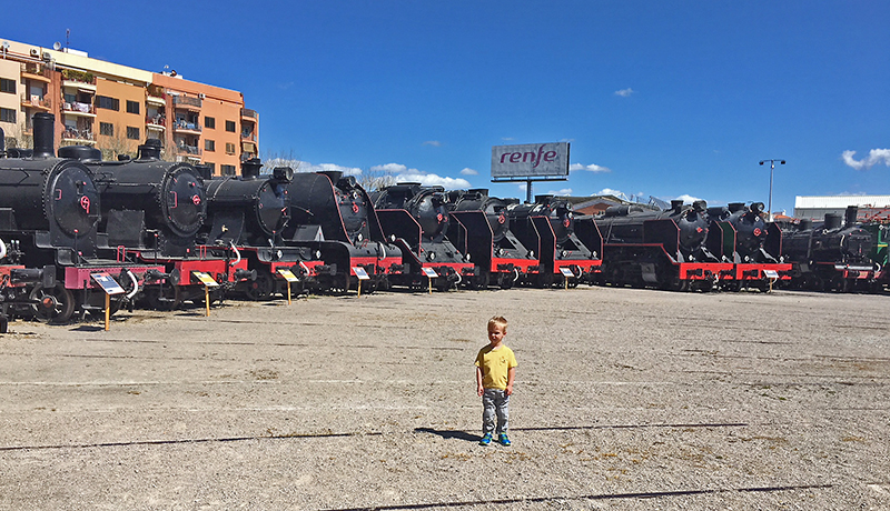 Elliot Graham surrounded by trains at Vilanova Railway Museum